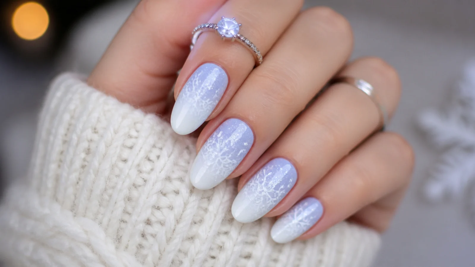 Powder blue to white ombre winter snowflake nails with white snowflakes
