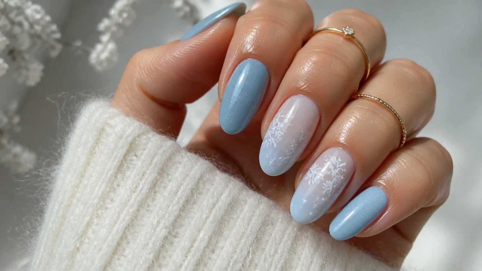 A well-sealed icy blue snowflake manicure with cuticle oil for longevity