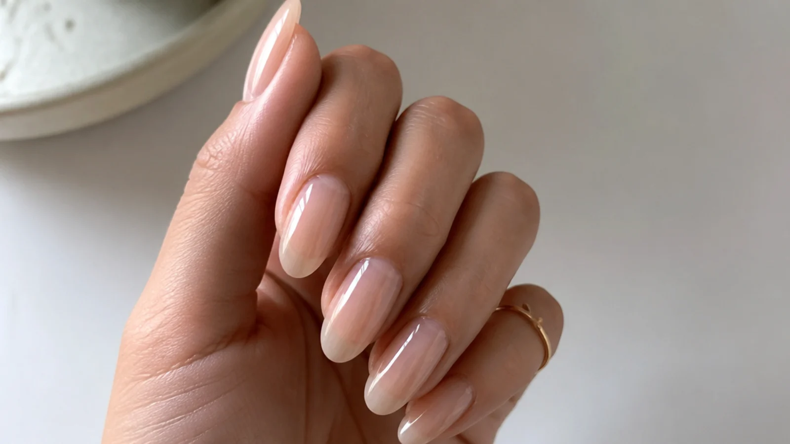 Sheer watery beige almond soap nails with a translucent glassy finish