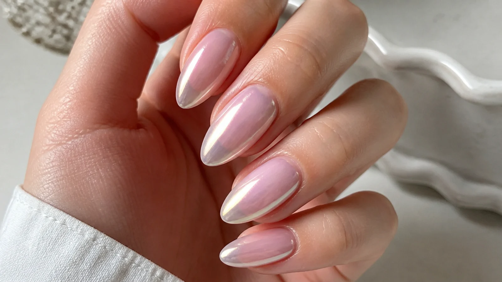 Sheer soap nails with a soft pearl chrome glaze on almond nails