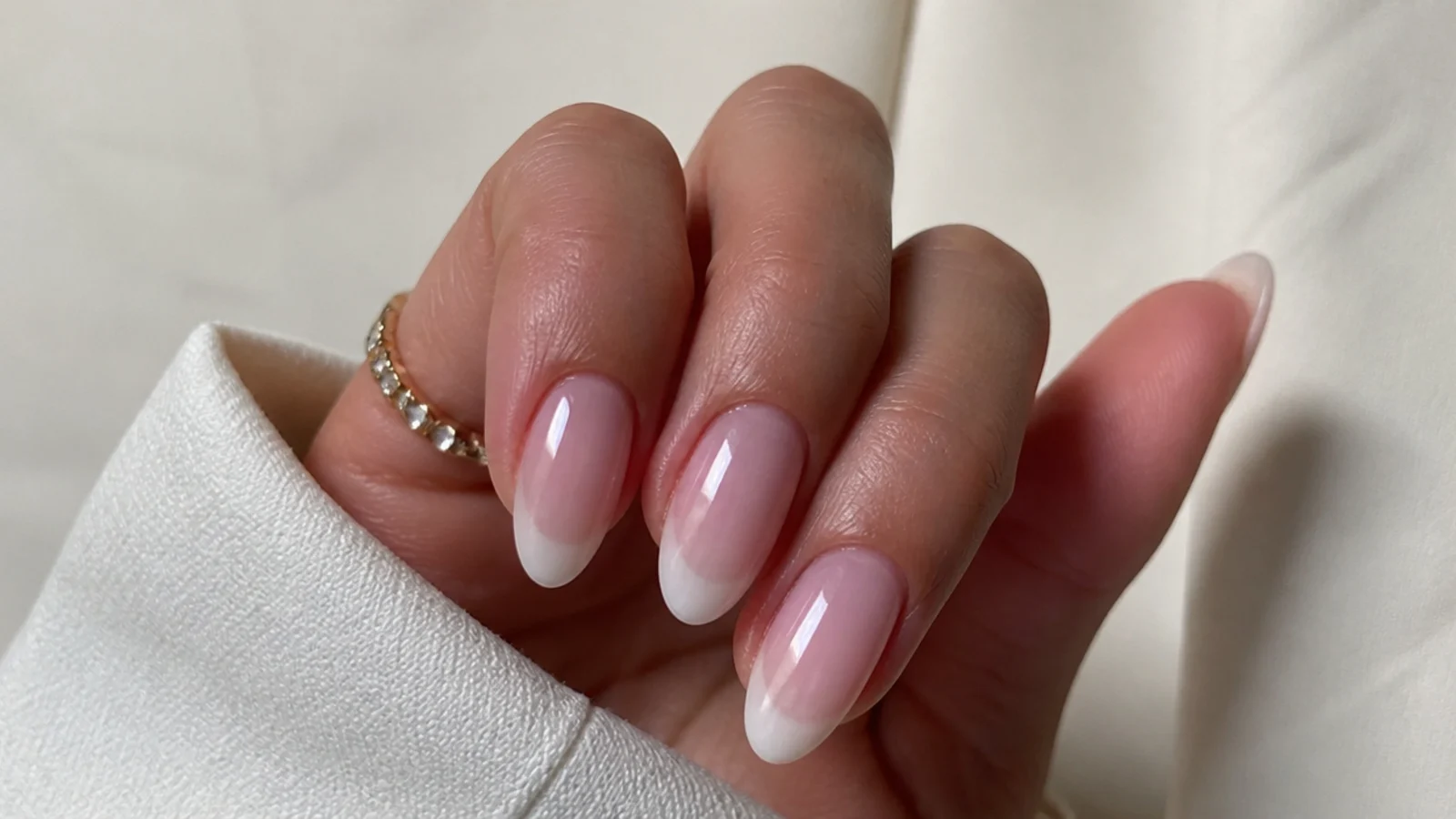 Sheer soap nails with a soft translucent white tip on almond nails