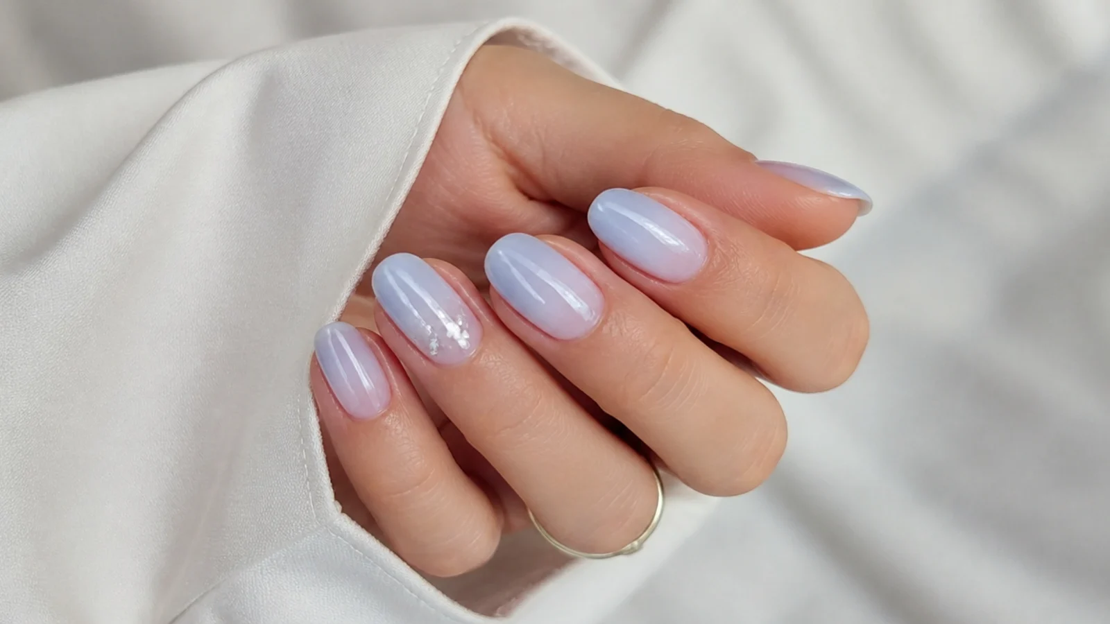 Sheer cool-toned milky soap nails with a faint blue-white cast