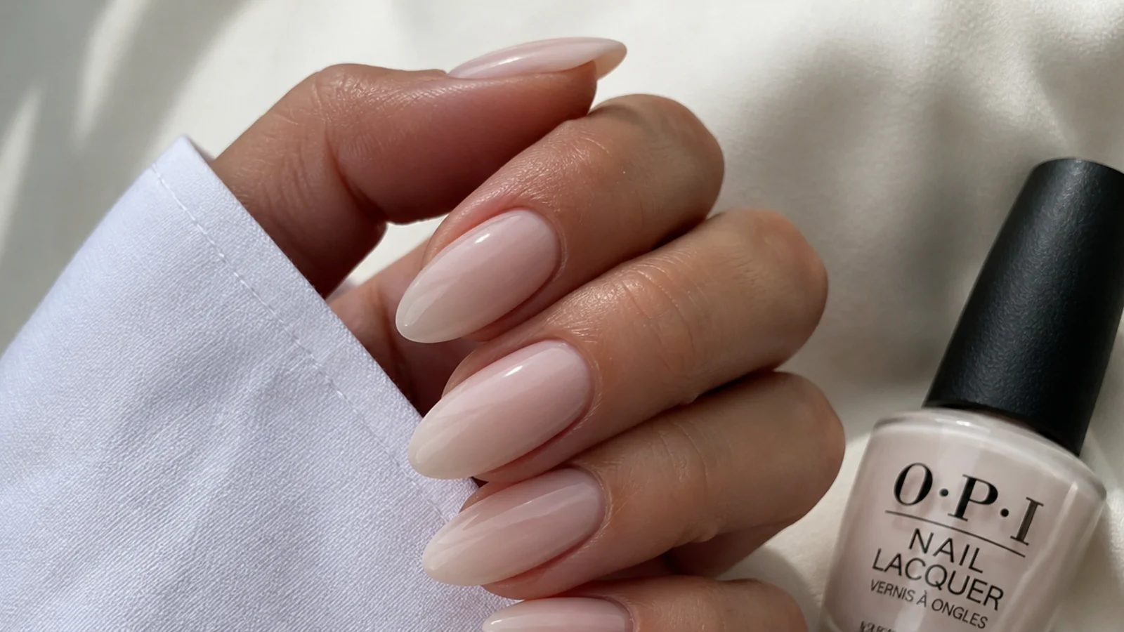 Sheer soap nails in a milky OPI shade on almond nails