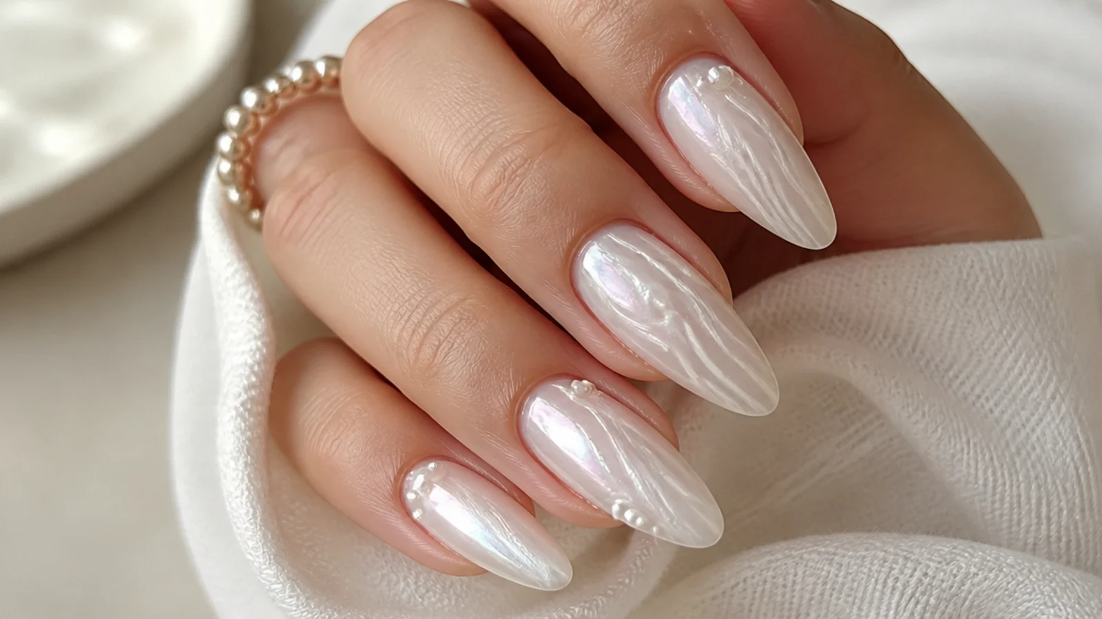 Long almond soap nails with a sheer milky base and soft pearl glaze