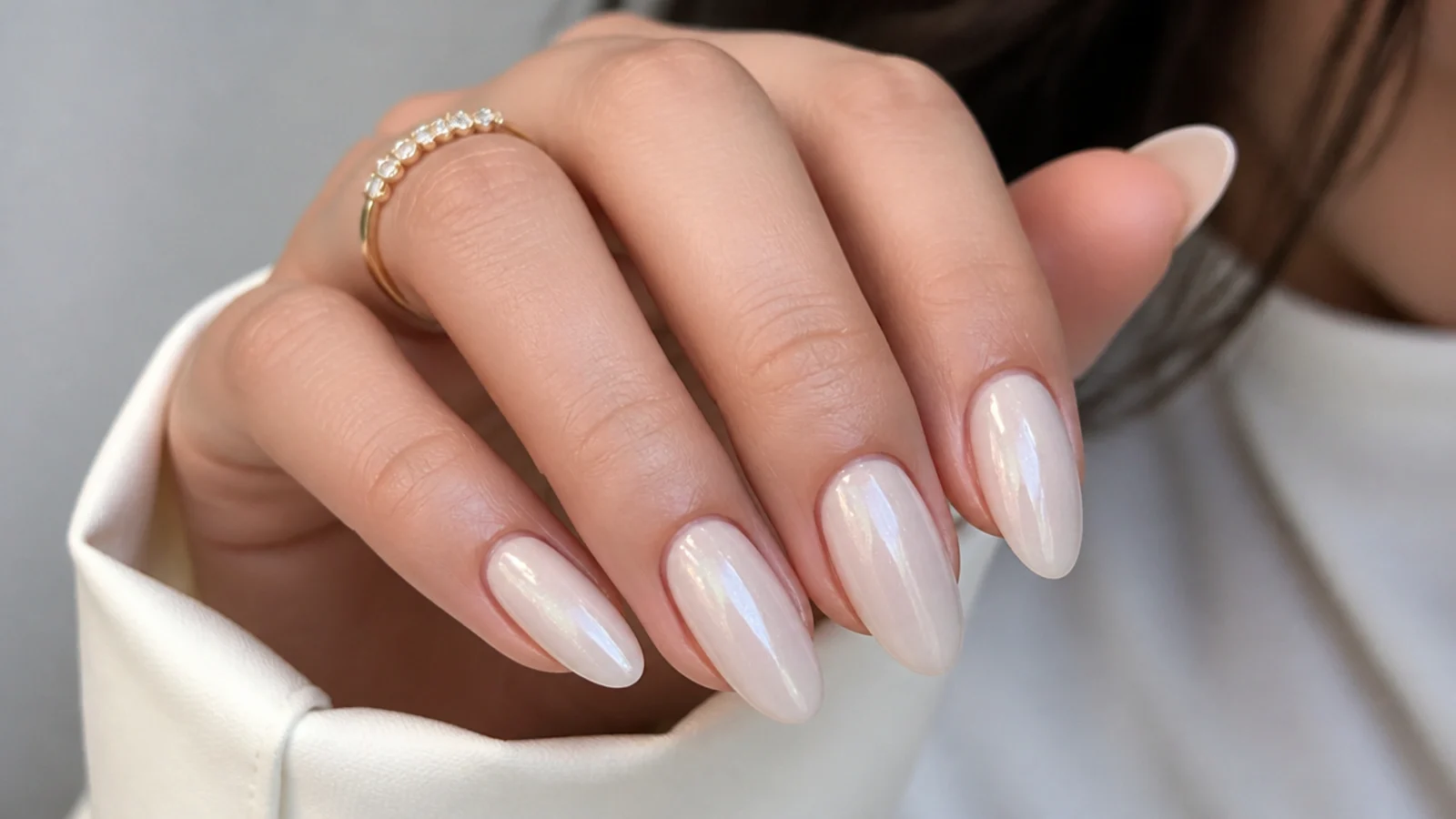 Long almond soap nails in a sheer milky finish with a soft pearl shimmer