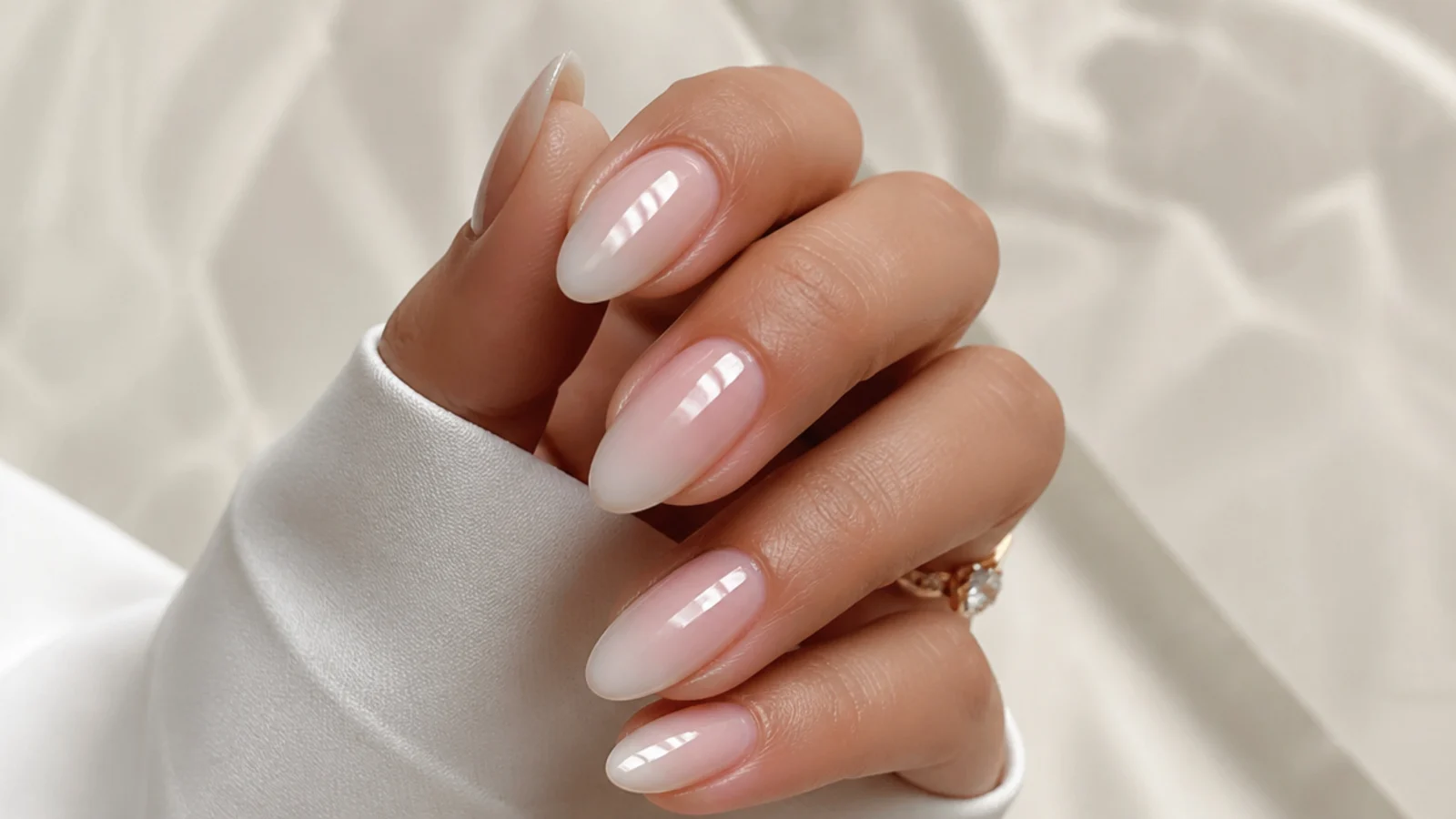 Elegant sheer soap nails on almond nails for a bridal clean look
