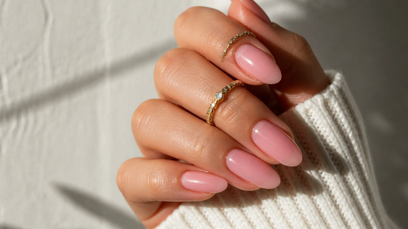 Sheer warm baby-pink OPI soap nails on almond nails, natural finish