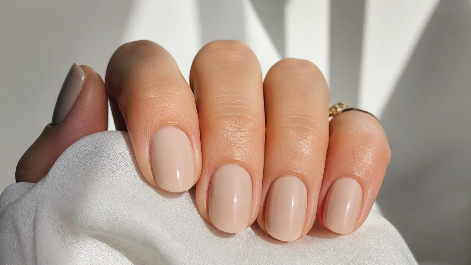 Sheer creamy sand-nude OPI soap nails on short oval nails