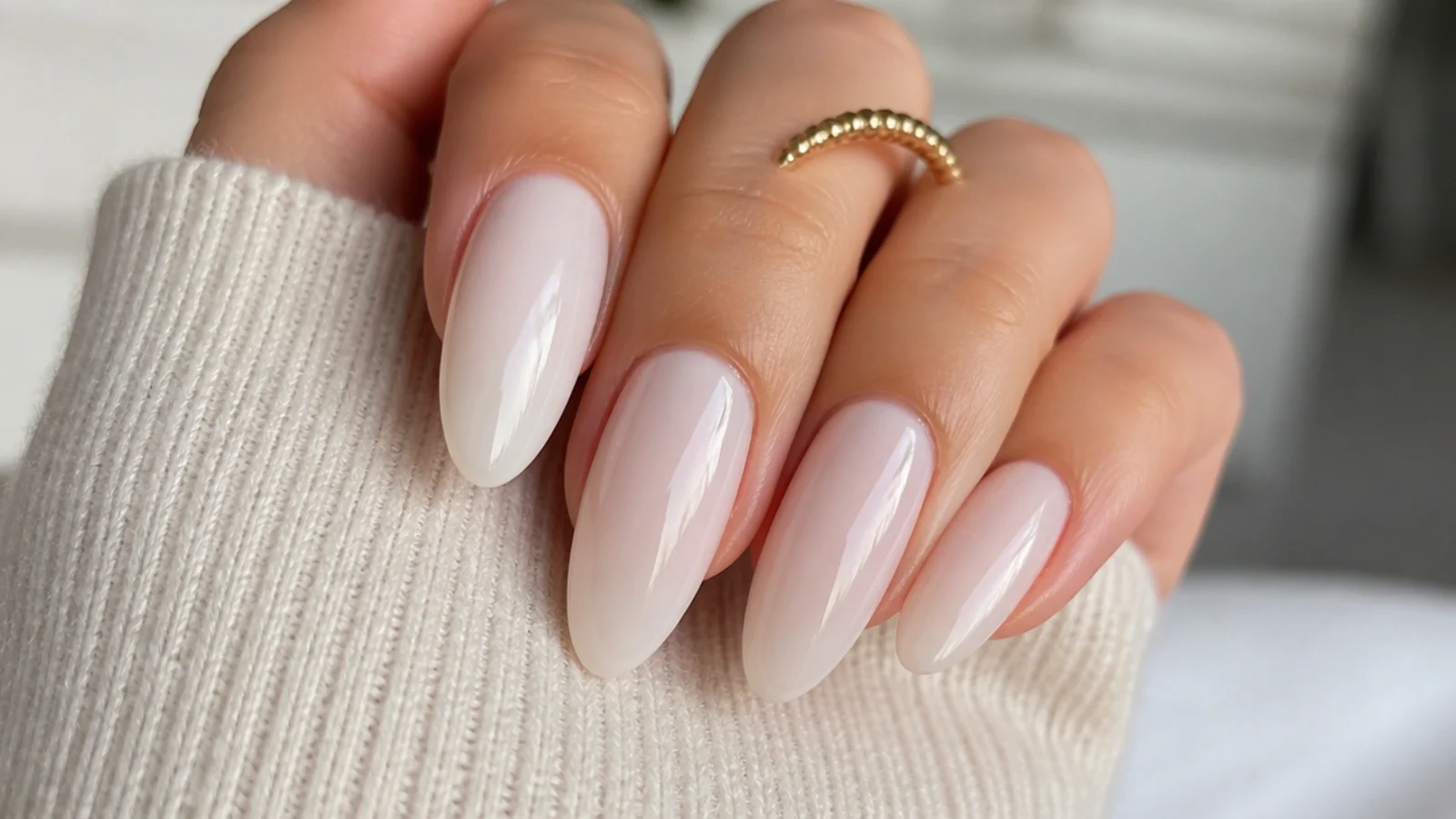 Sheer milky neutral-white OPI soap nails on long almond nails