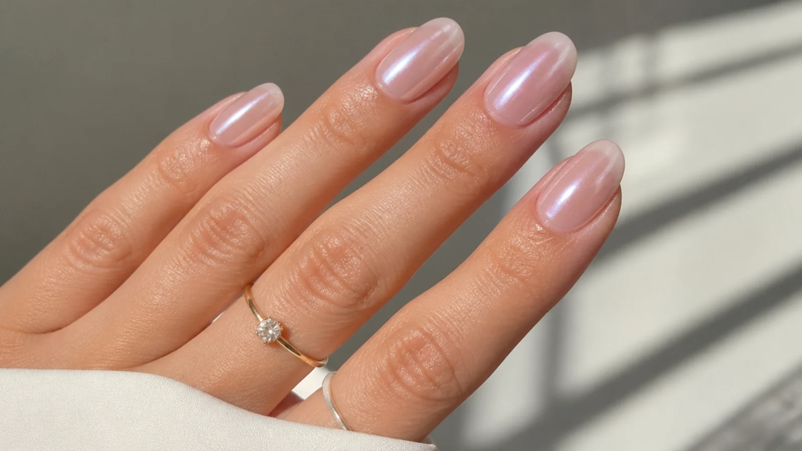 Sheer milky oval soap nails with a soft pearl chrome glaze
