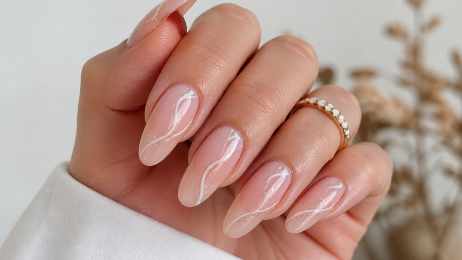Long sheer pink oval soap nails with an elegant elongated tip