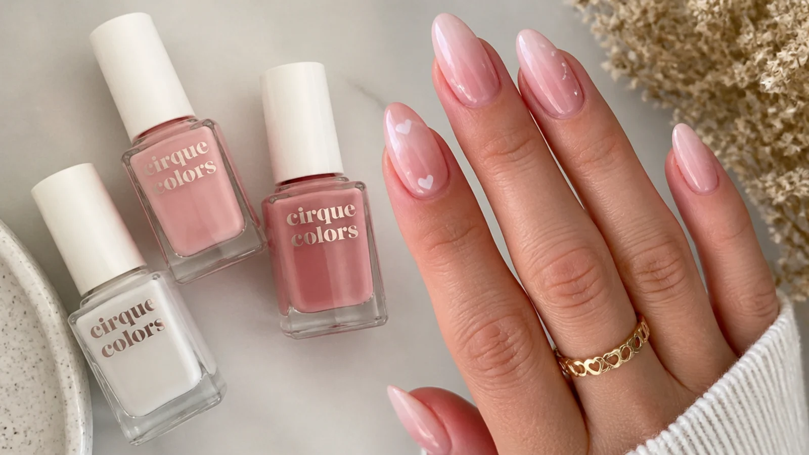 A flat lay of sheer milky and pink soap nail polish bottles
