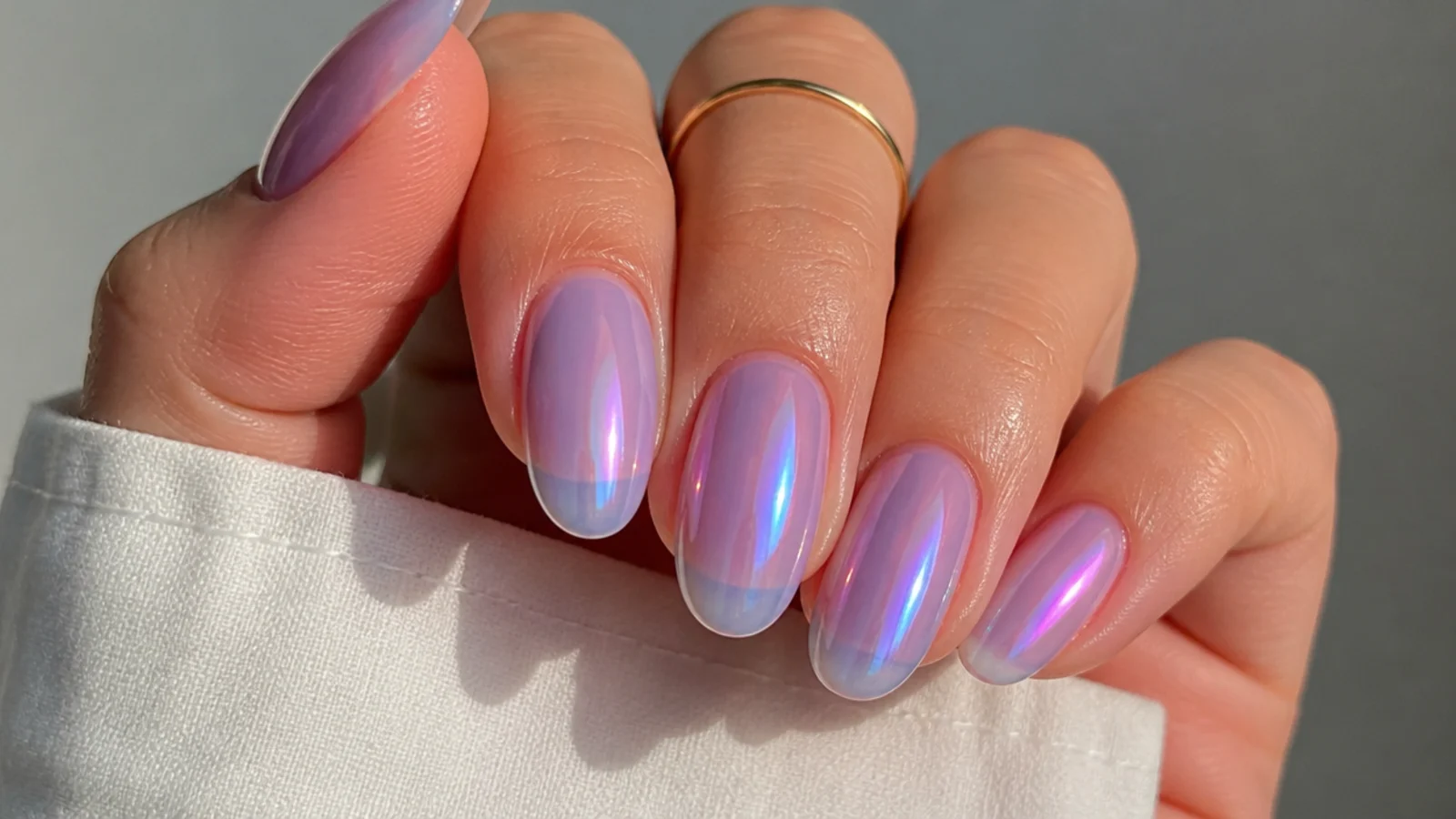 Sheer lilac soap bubble nails with a duochrome pink and blue flash