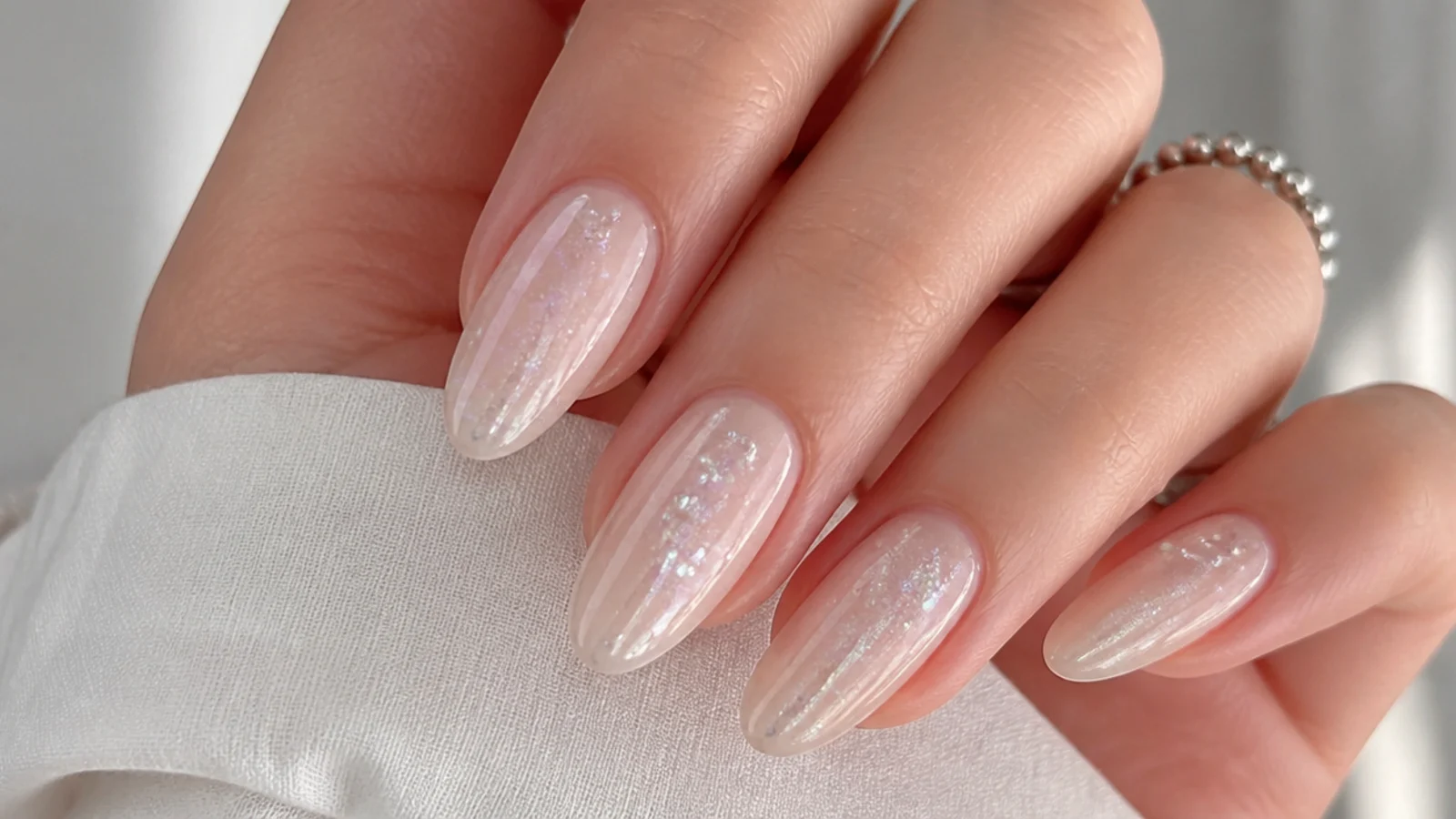 Sheer soap nails with a cool silver iridescent bubble shimmer
