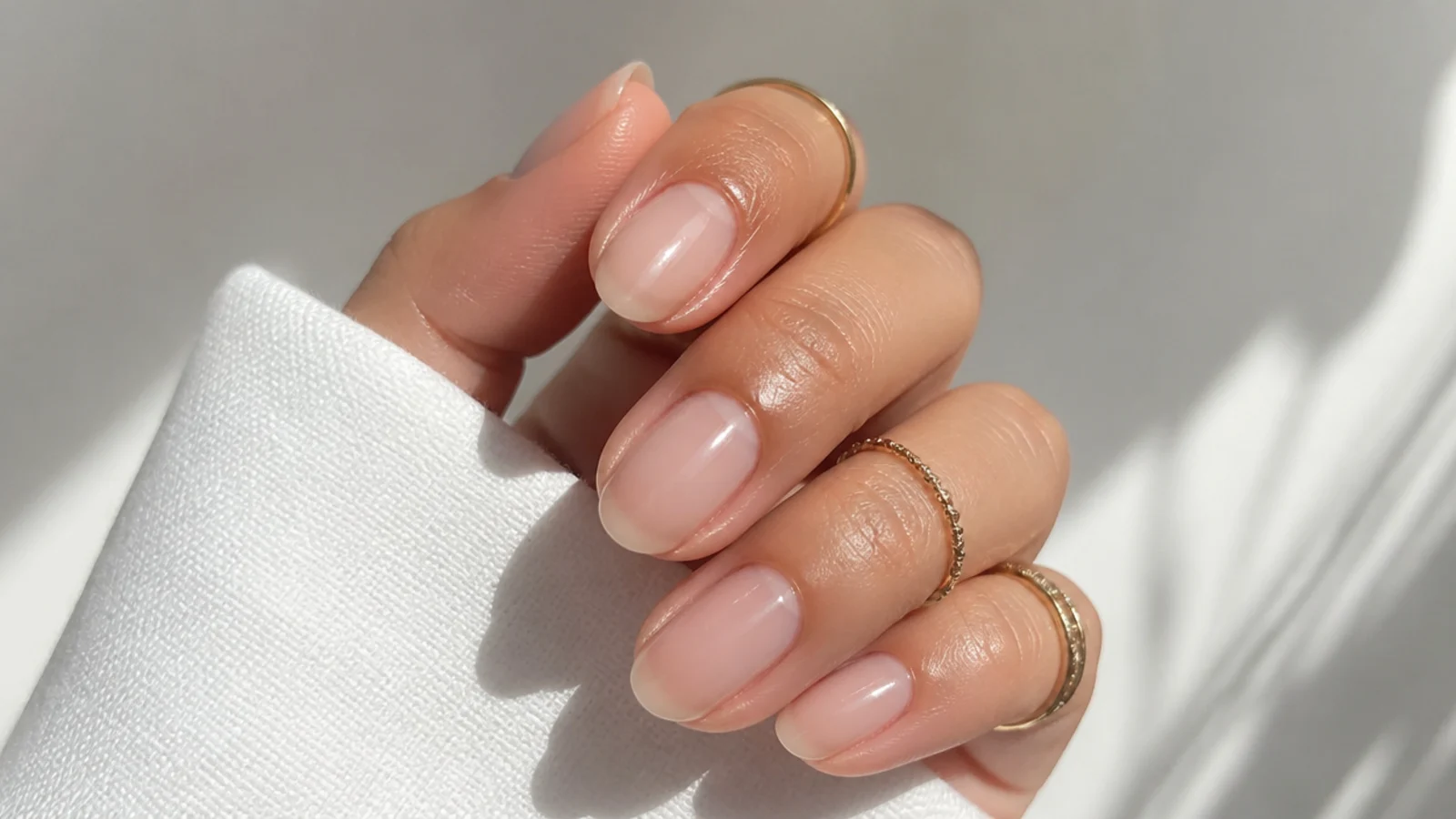 Bare buffed soap nails sealed with high-gloss clear top coat for a wet look