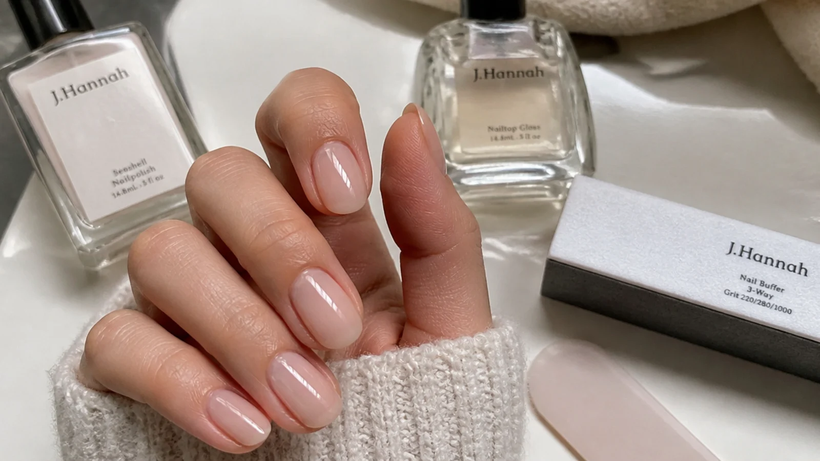 At-home soap nails with sheer polish, buffer and glossy top coat supplies