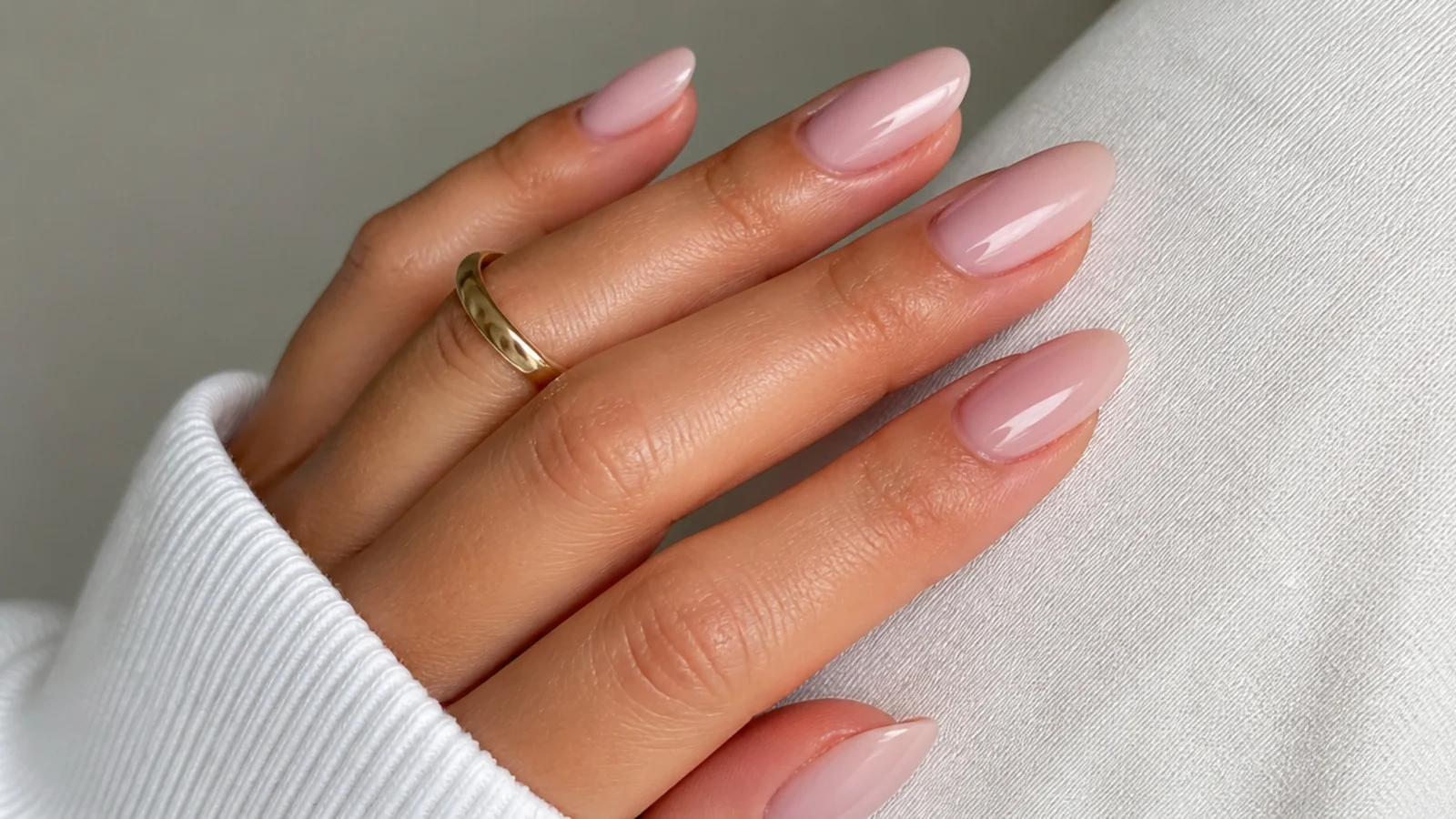 Almond nails in a barely-there sheer ballet pink soap finish