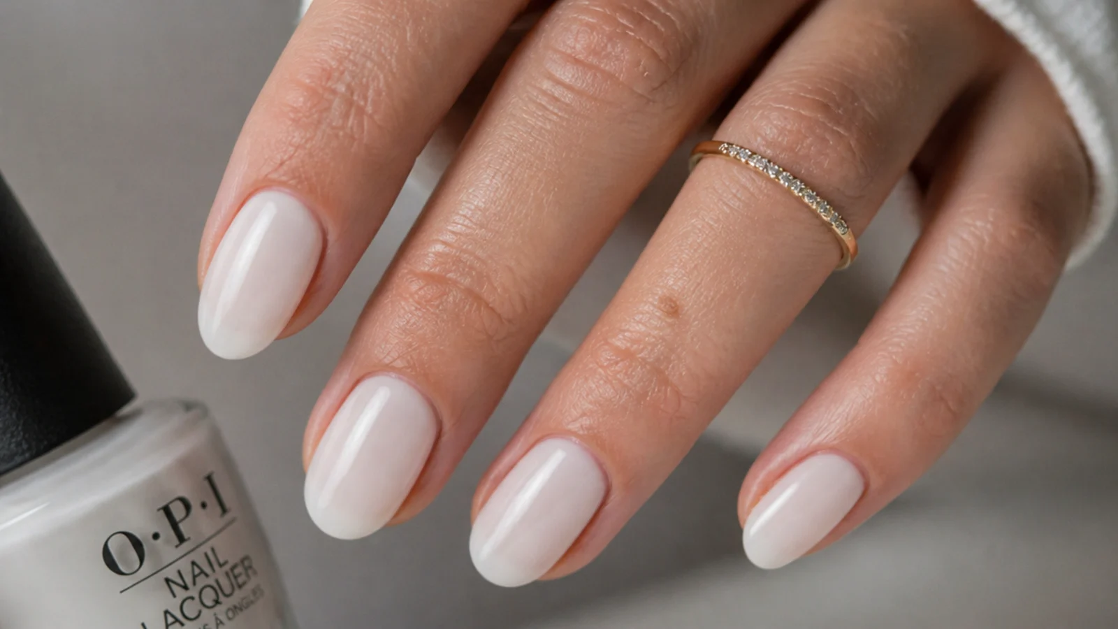 Short almond nails in OPI Funny Bunny sheer milky white soap finish