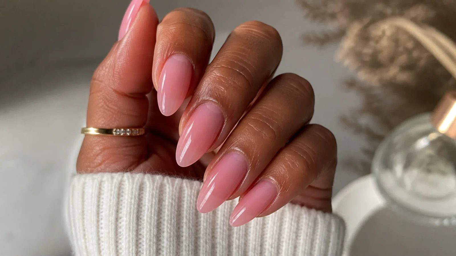 Almond nails in a sheer cool-pink soap finish flattering deeper skin