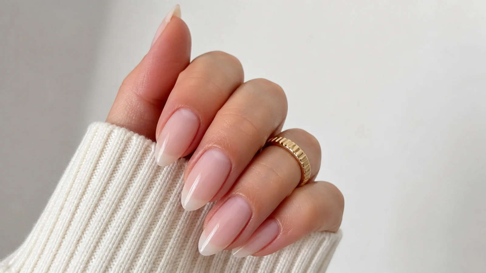 Long almond nails in a sheer milky-clear soap finish with visible free edges