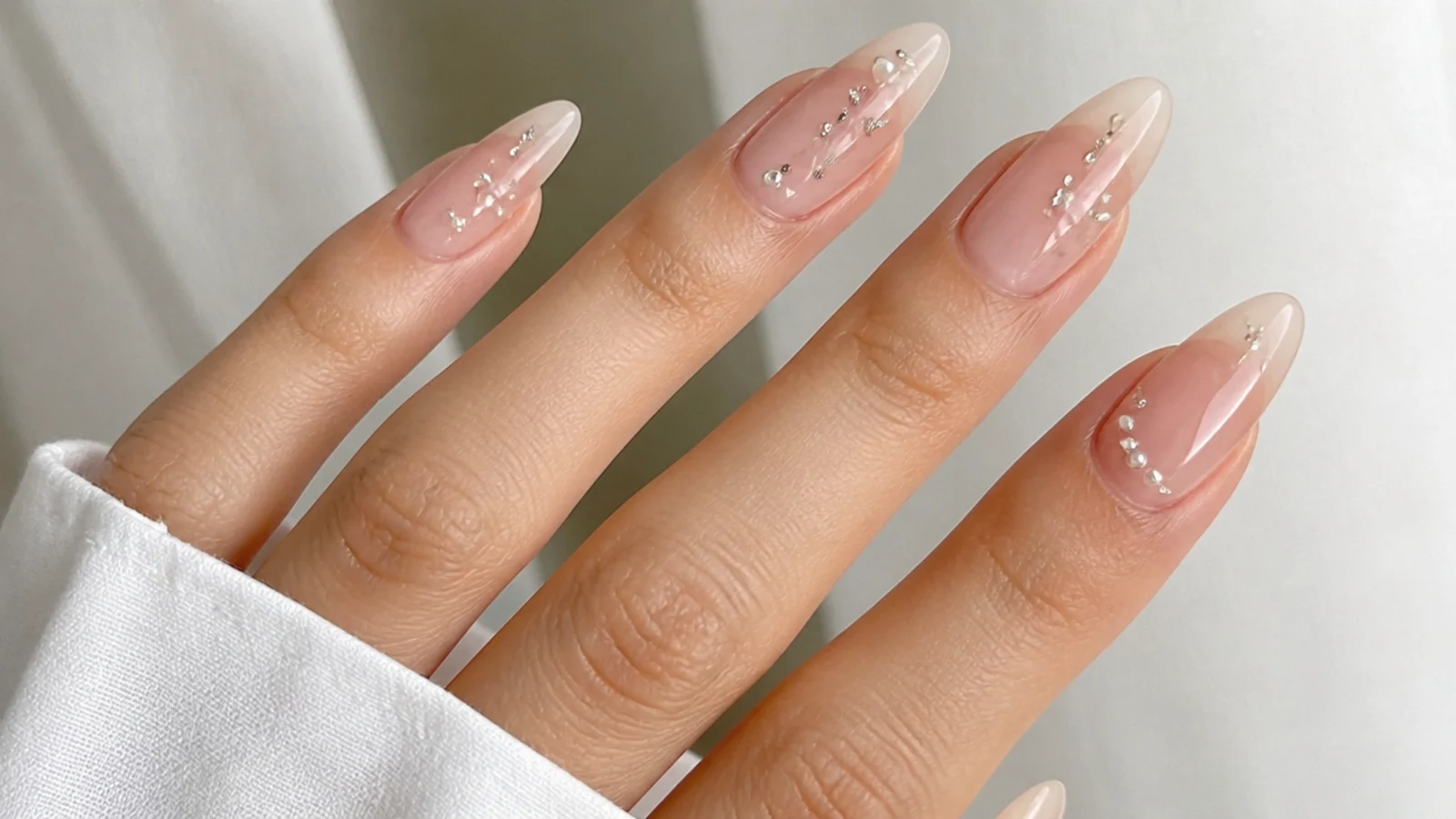 Sheer glassy soap nails on long almond extensions