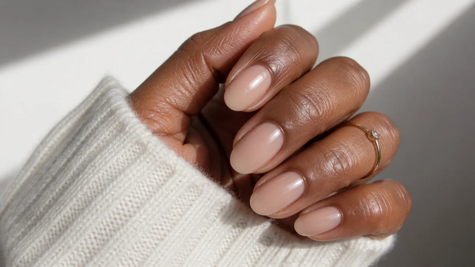 Sheer warm nude soap nails on medium oval natural nails on deeper skin