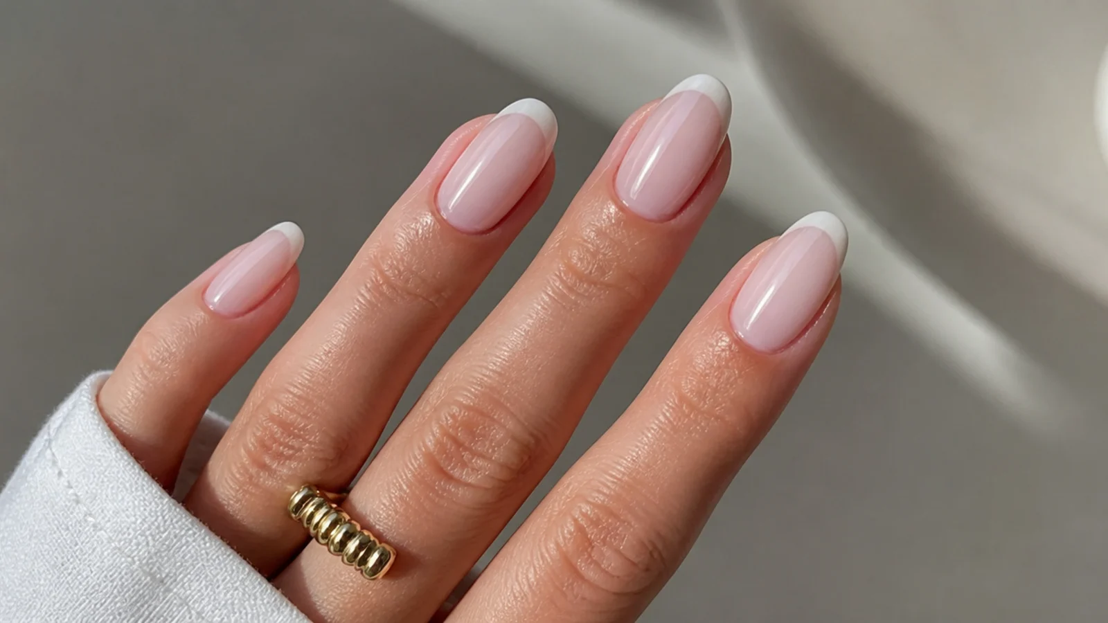 Sheer milky soap nails with a barely-there soft white tip on almond nails