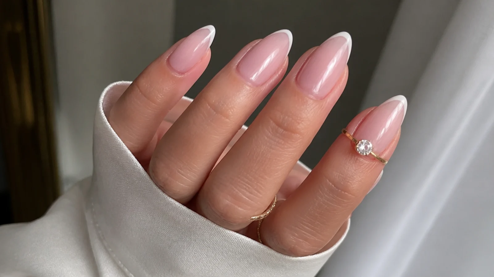 Sheer soap nails with a barely-there soft white French tip on almond nails