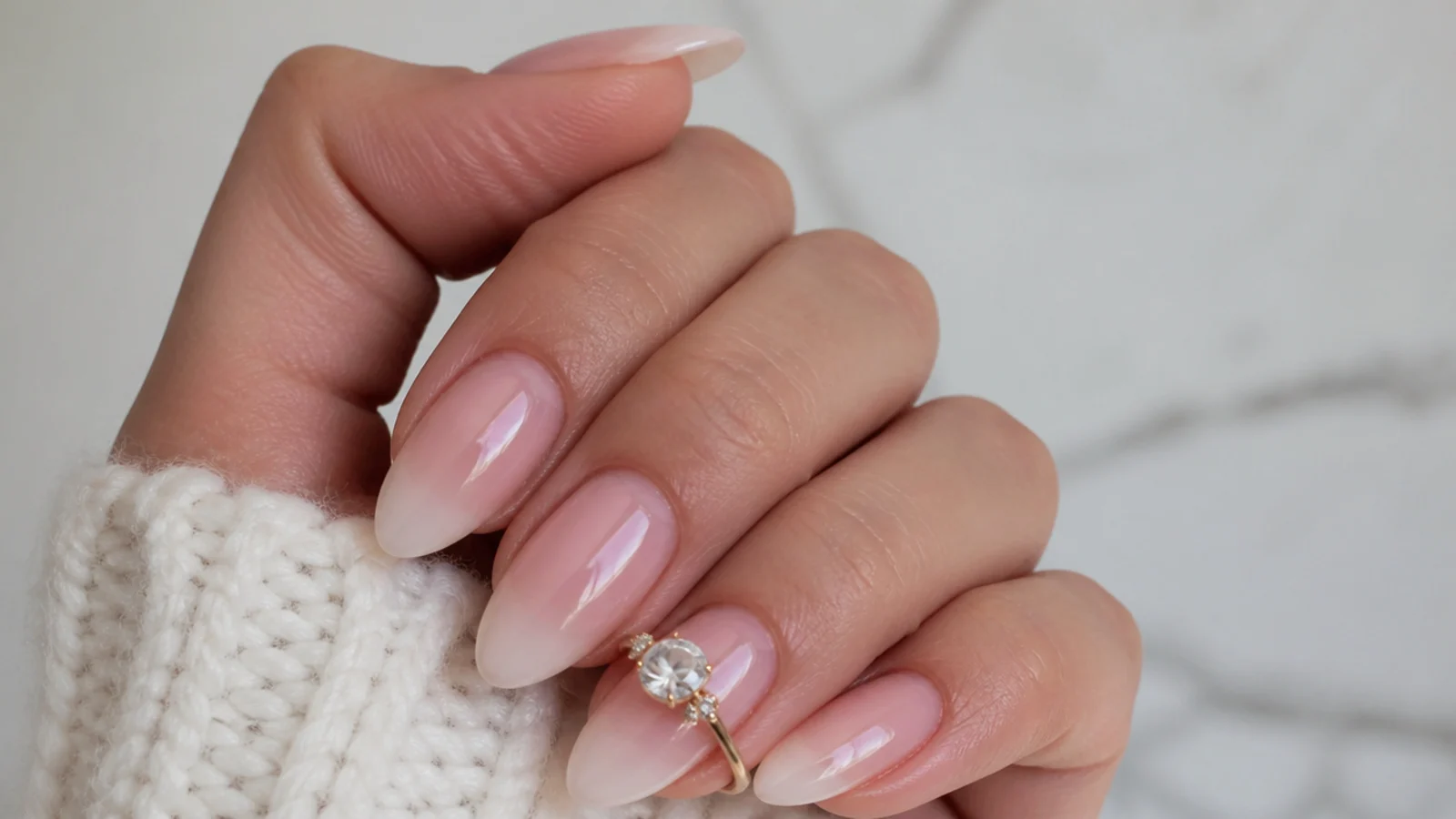 Sheer soap nails with a soft baby-boomer pink-to-milky gradient on almond
