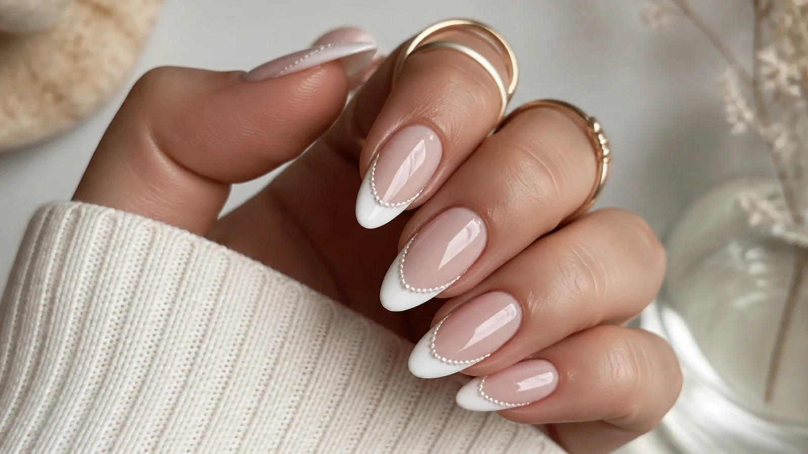White chrome French tip nails with a pearl chrome smile line on almond nails