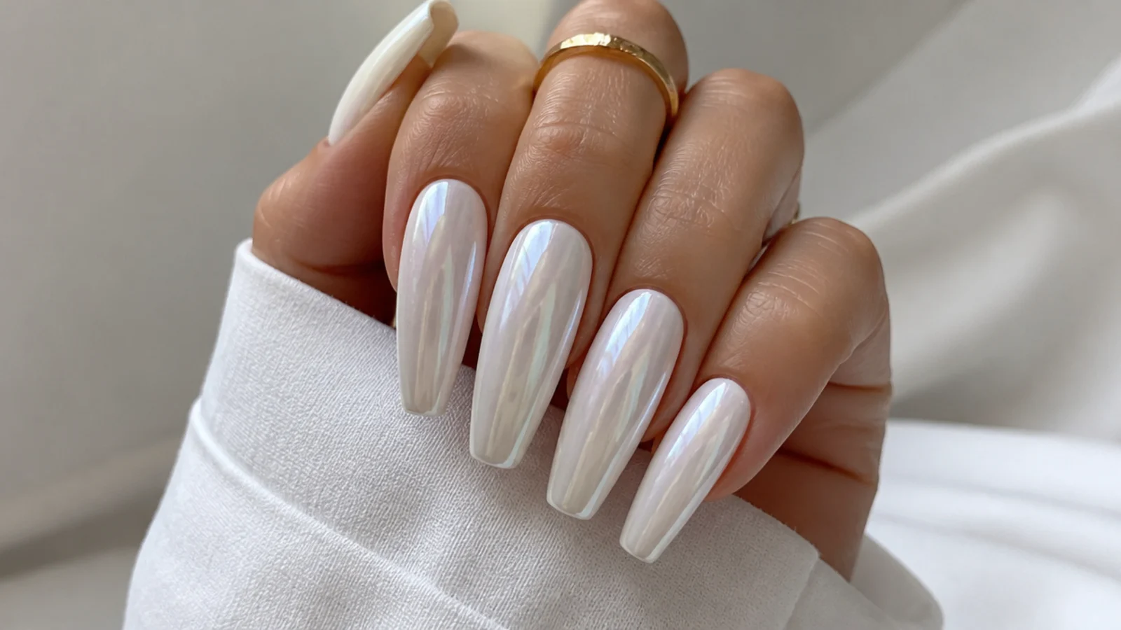 Long coffin white chrome nails with a full pearl sheen