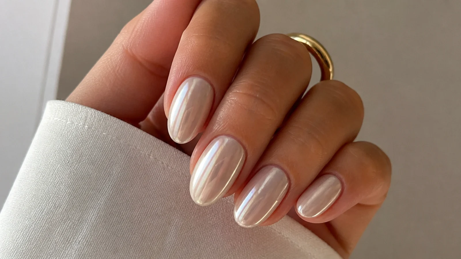 Off-white cream white chrome nails with a soft warm pearl glow