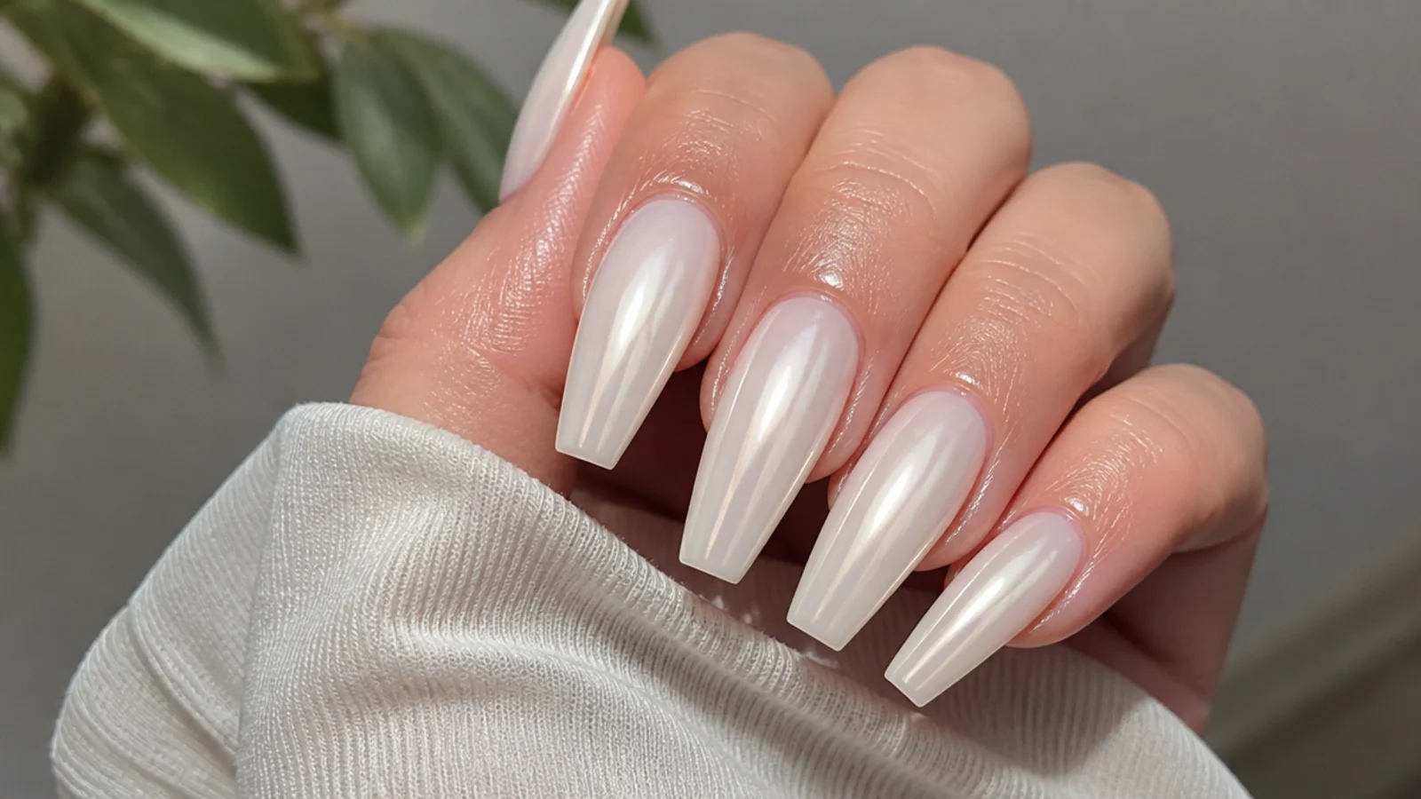 Long coffin pearl white chrome nails with a glassy wet-look finish