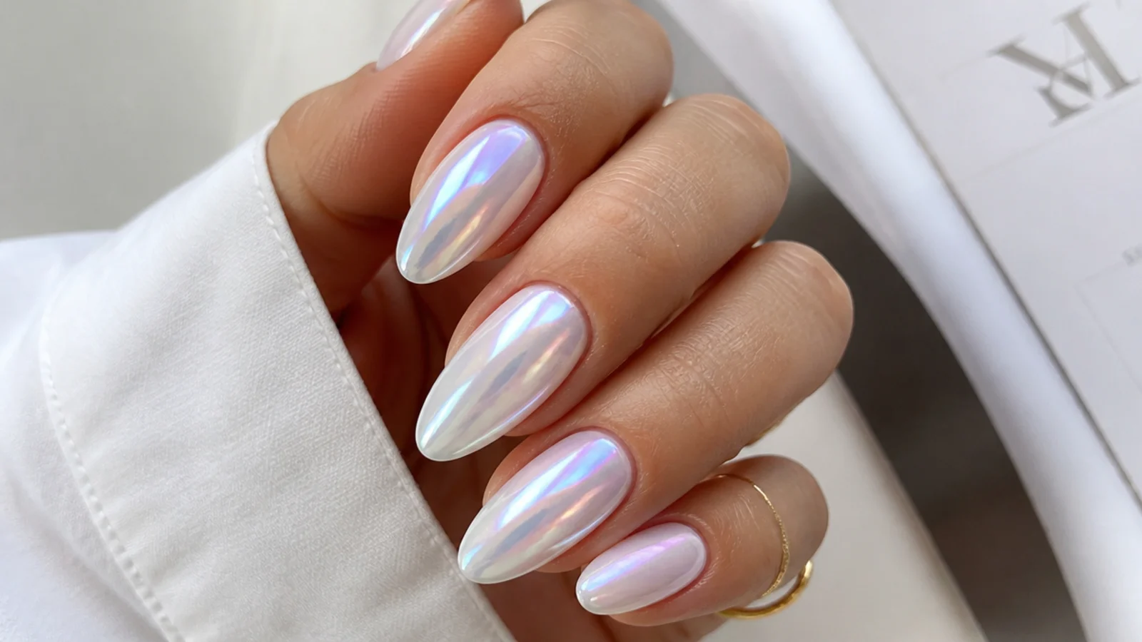 Milky white chrome nails with iridescent aurora pink and blue shift