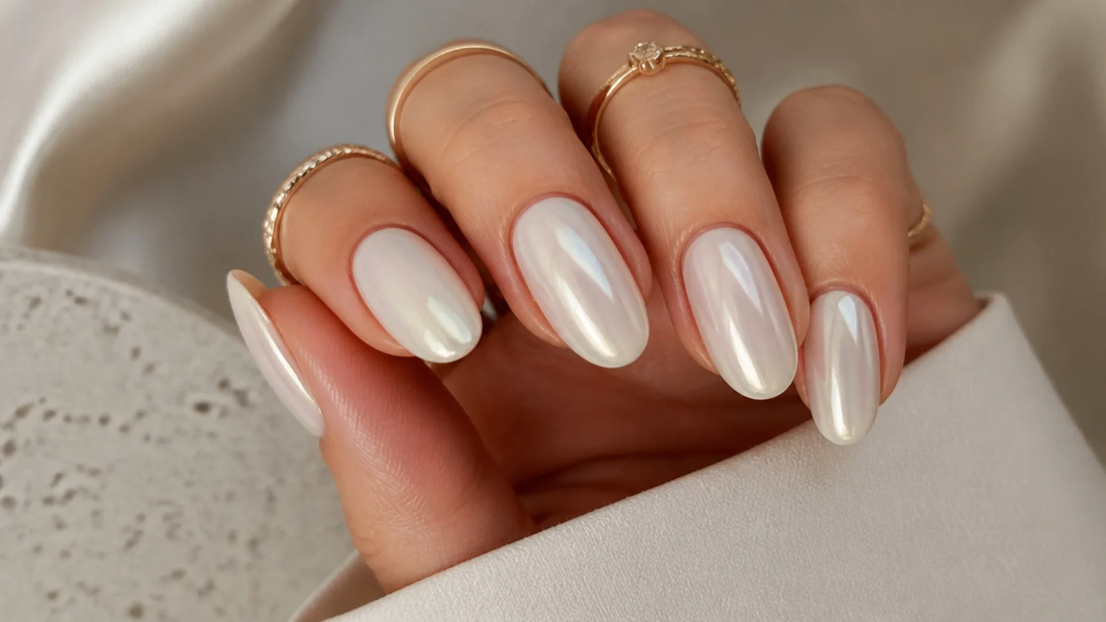 Off-white cream milky chrome nails with a soft warm pearl glow