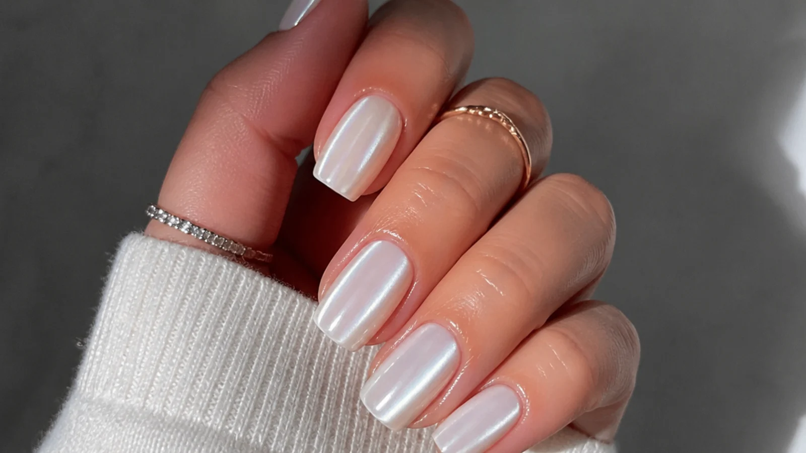 A well-sealed milky white chrome manicure with cuticle oil for longevity