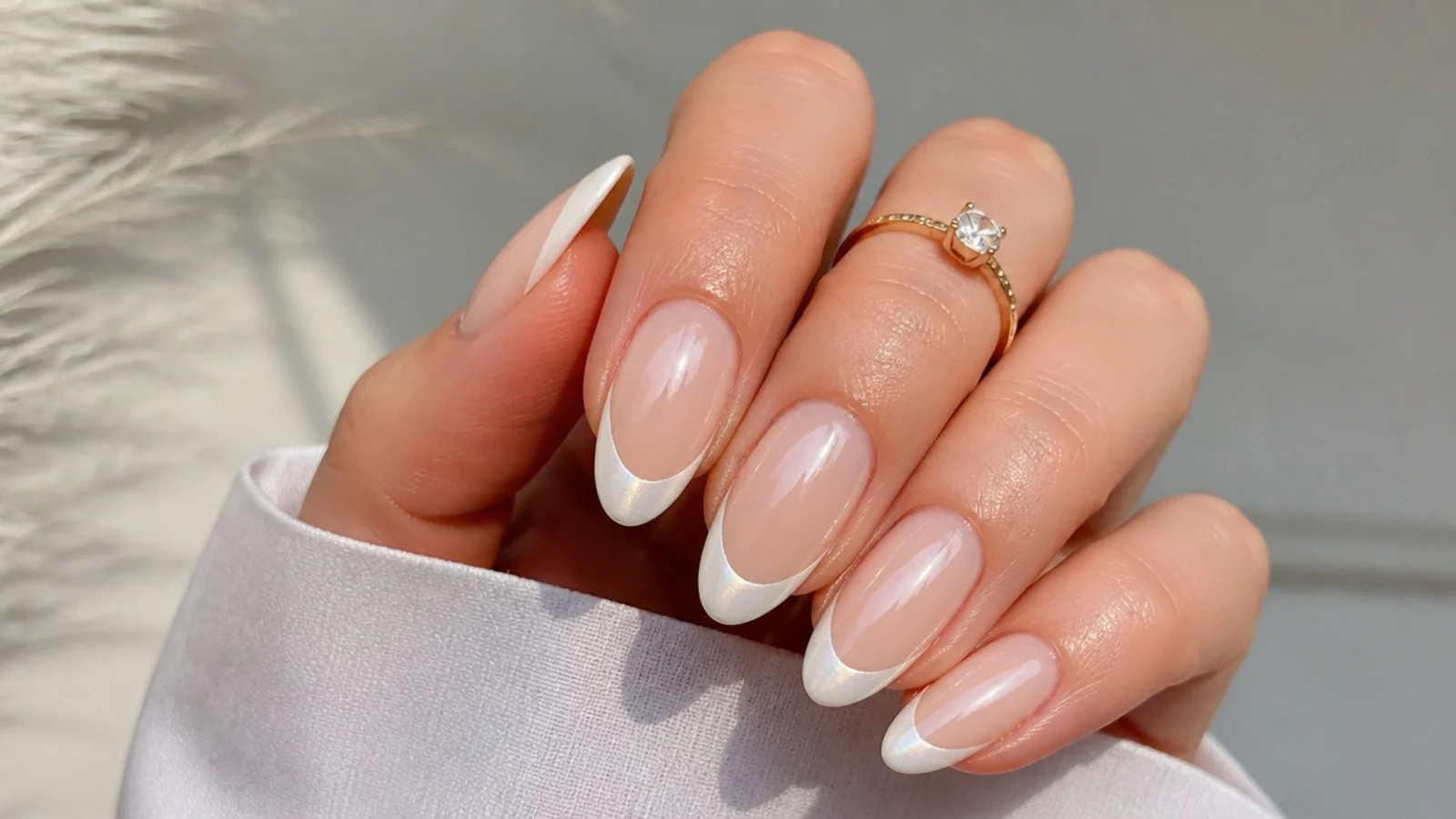 Sheer nude off white chrome nails with a milky white chrome French tip