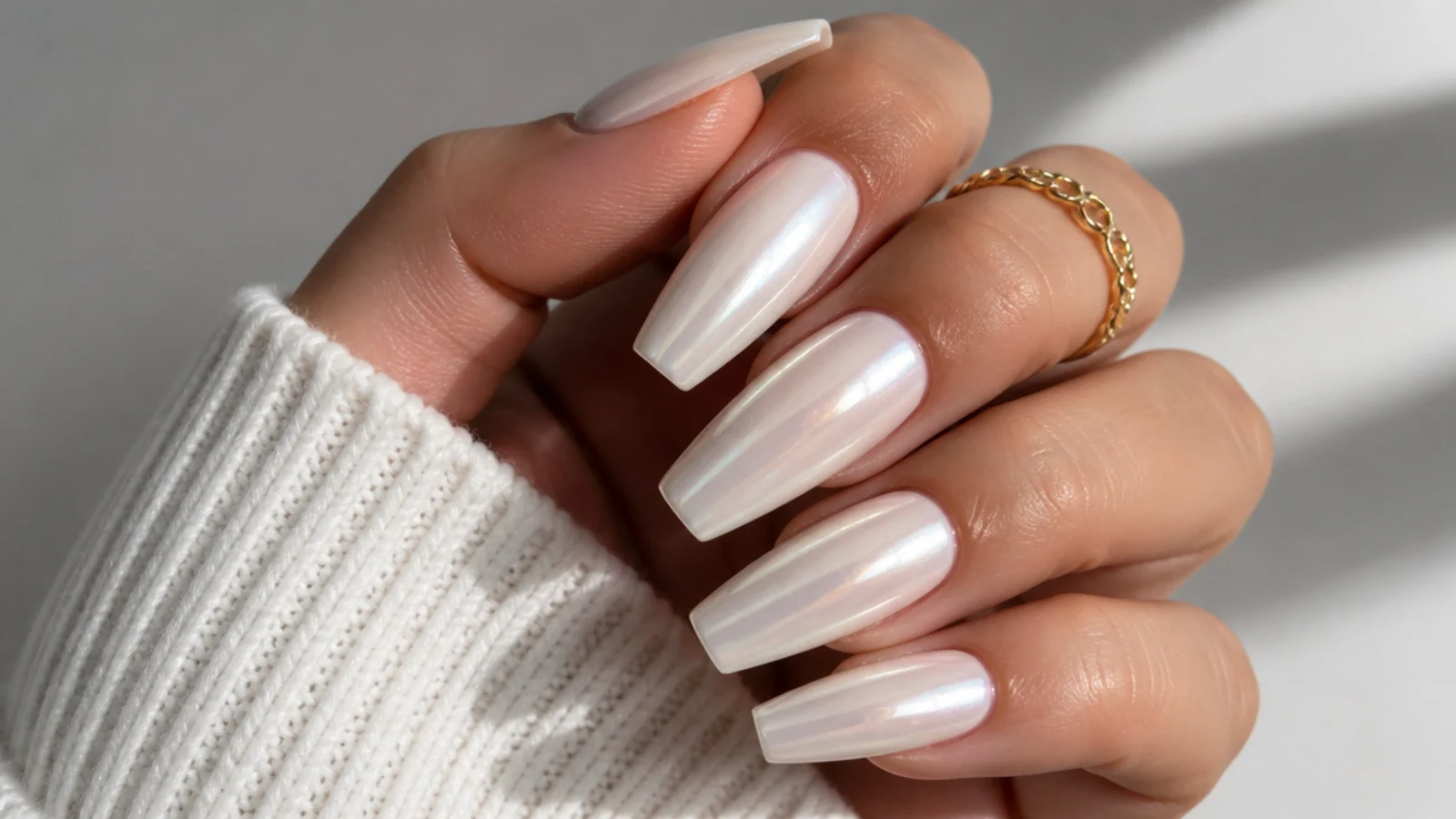 Long coffin off white chrome nails with a pearly milky glow