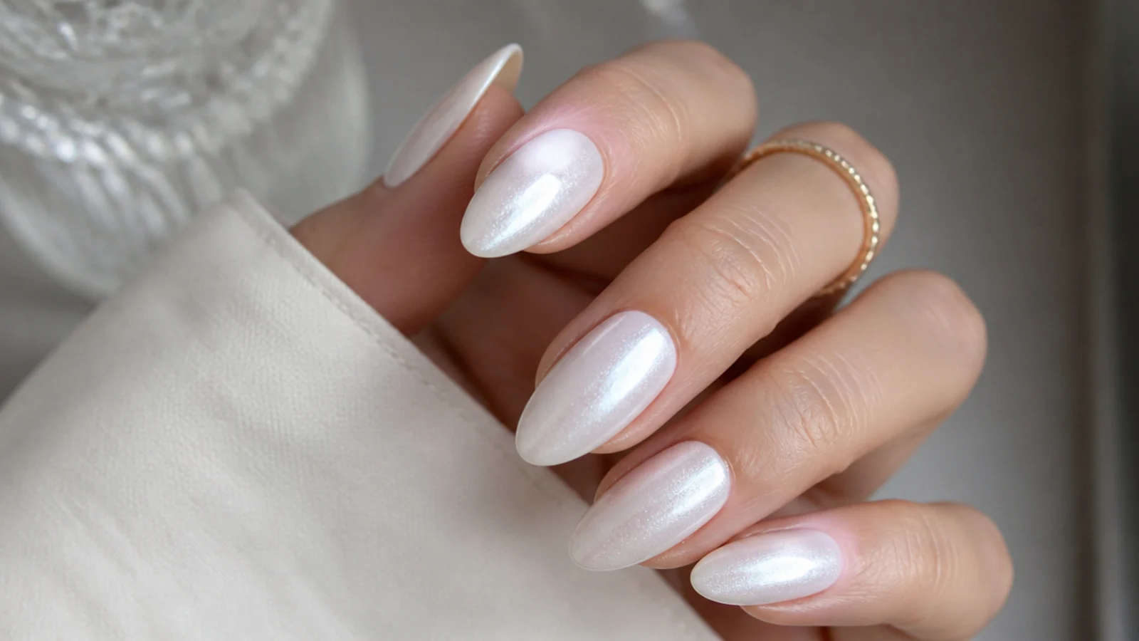 Frosty white off white chrome nails with a cool snow-like pearl finish