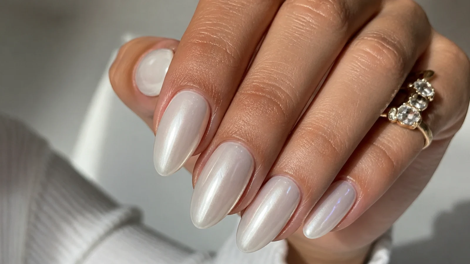 Glassy off white chrome nails with a smooth milk-glass sheen