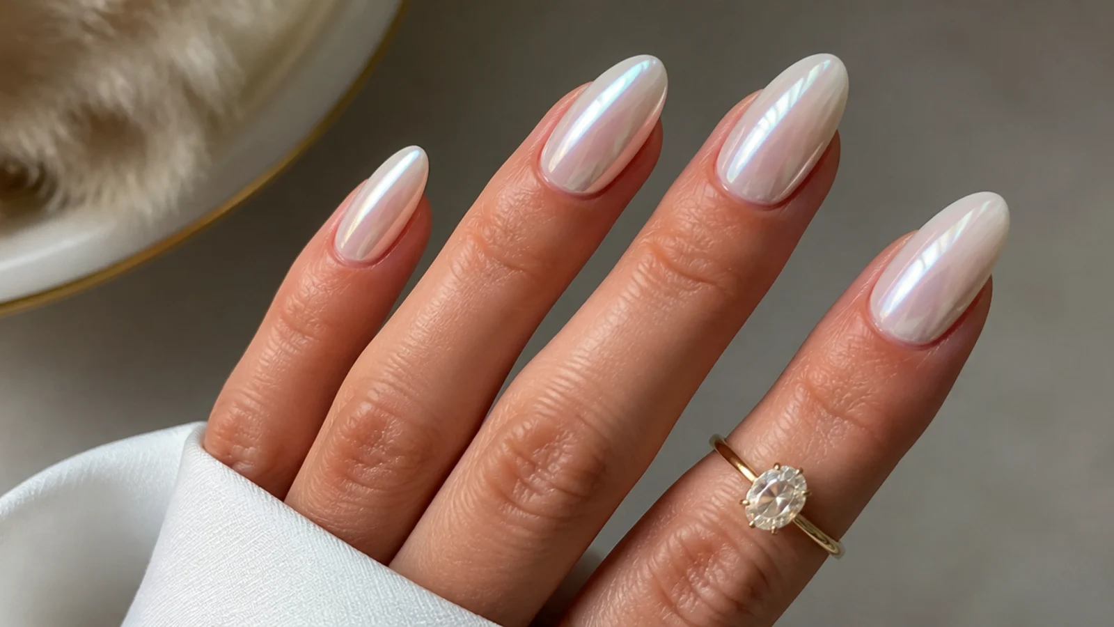 Long oval pearl white chrome nails with an elegant glazed glow