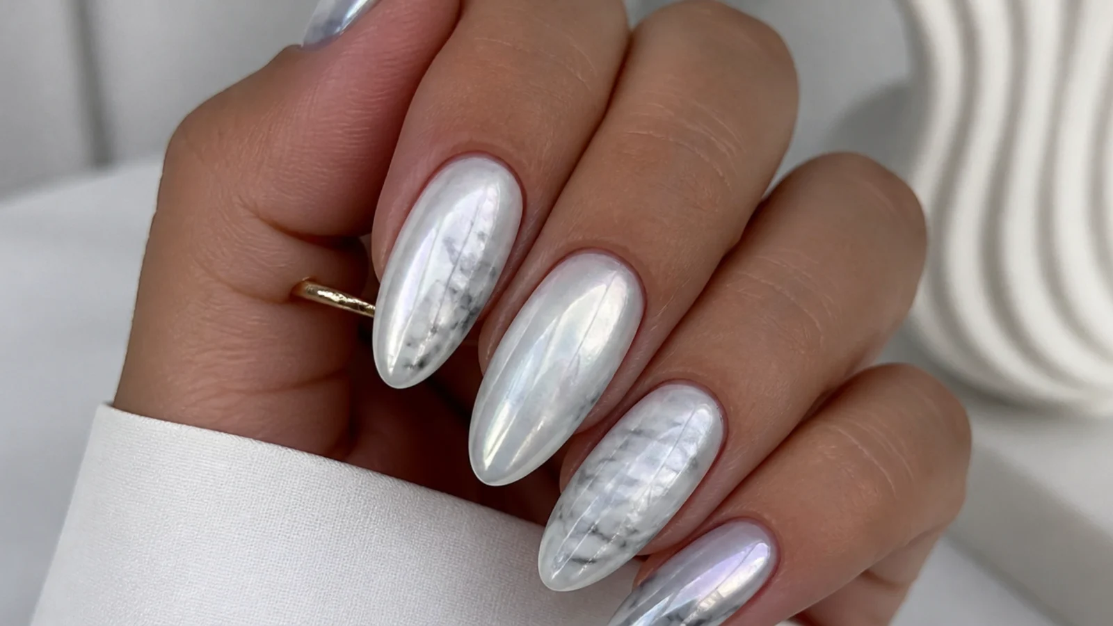 White and gray marble almond nails with a pearl chrome overlay
