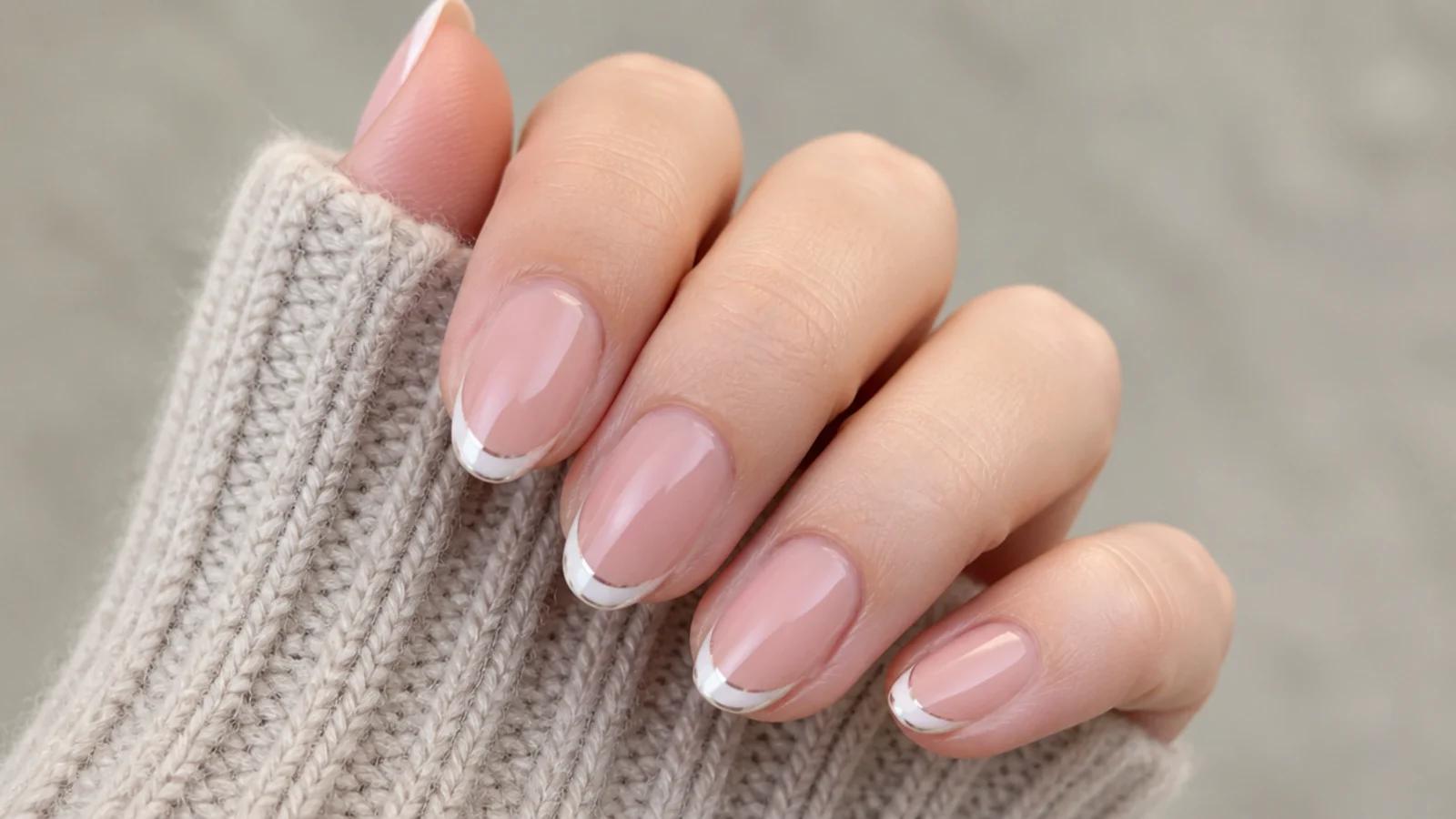 Sheer nude nails with white chrome painted French tips