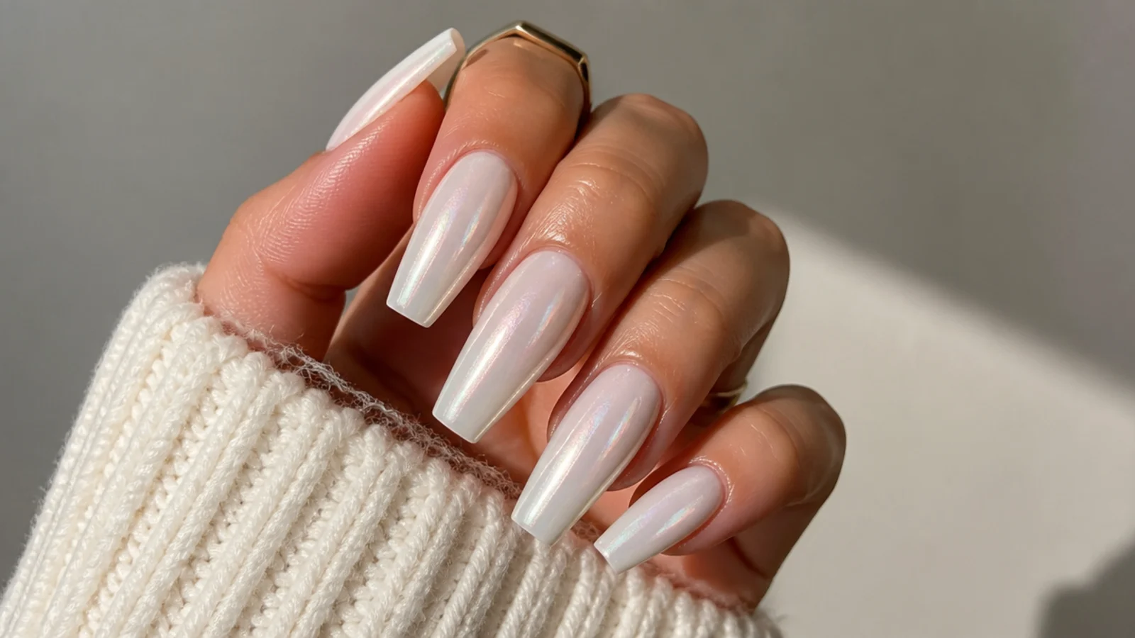 Long coffin nails with a glossy milky white chrome finish