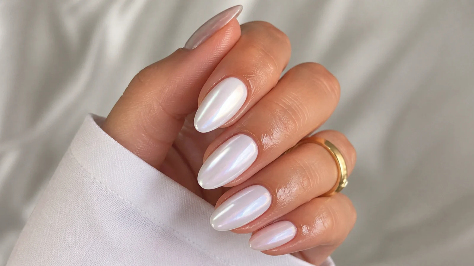 A well-sealed glossy white chrome manicure with cuticle oil for longevity