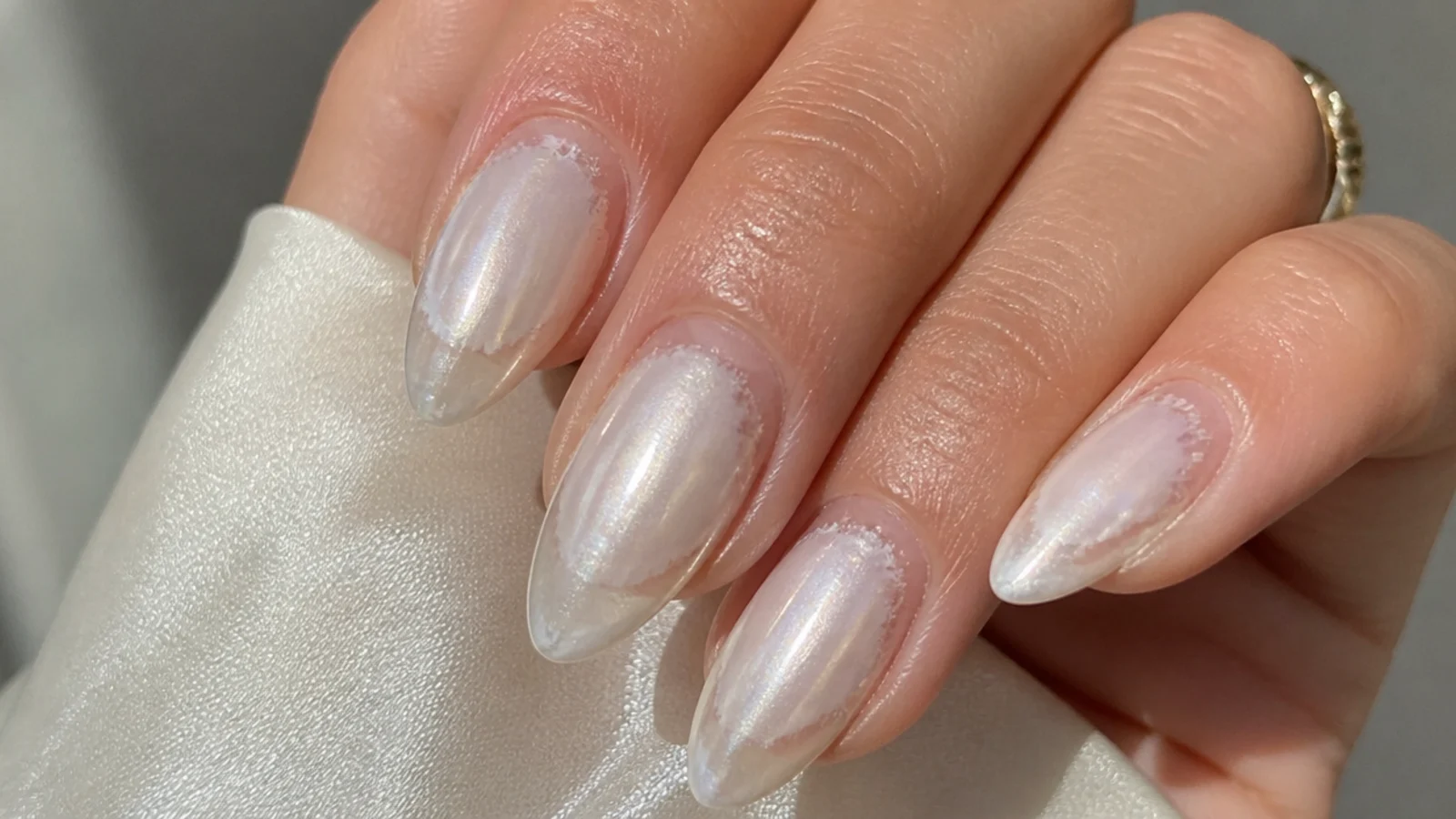 Dusty uneven white chrome with bald patches near the sidewalls and free edge