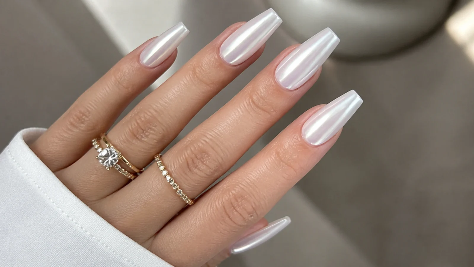 Long coffin white chrome nails with a full pearl glazed finish