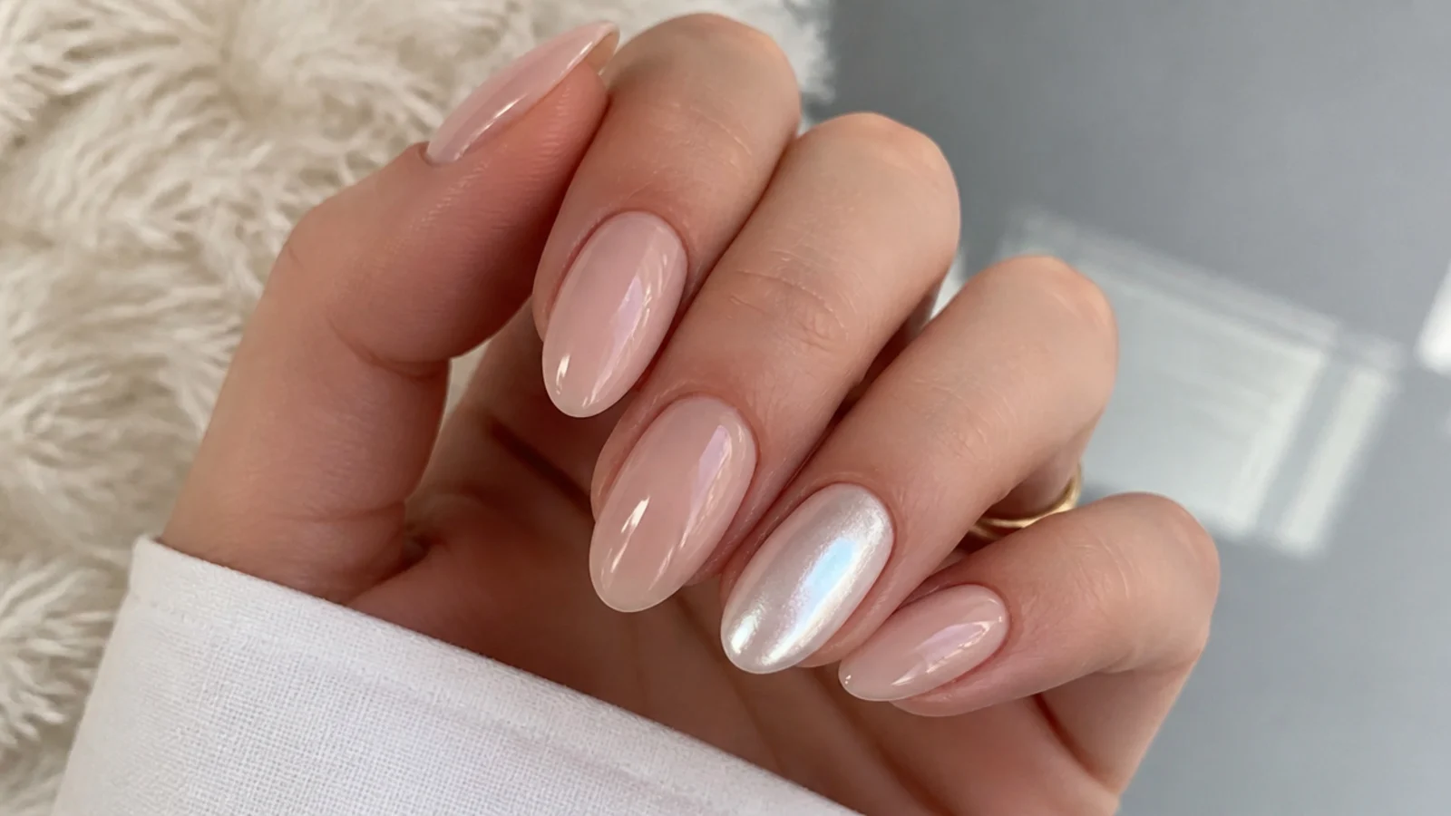 Milky nude nails with one pearl white chrome accent nail