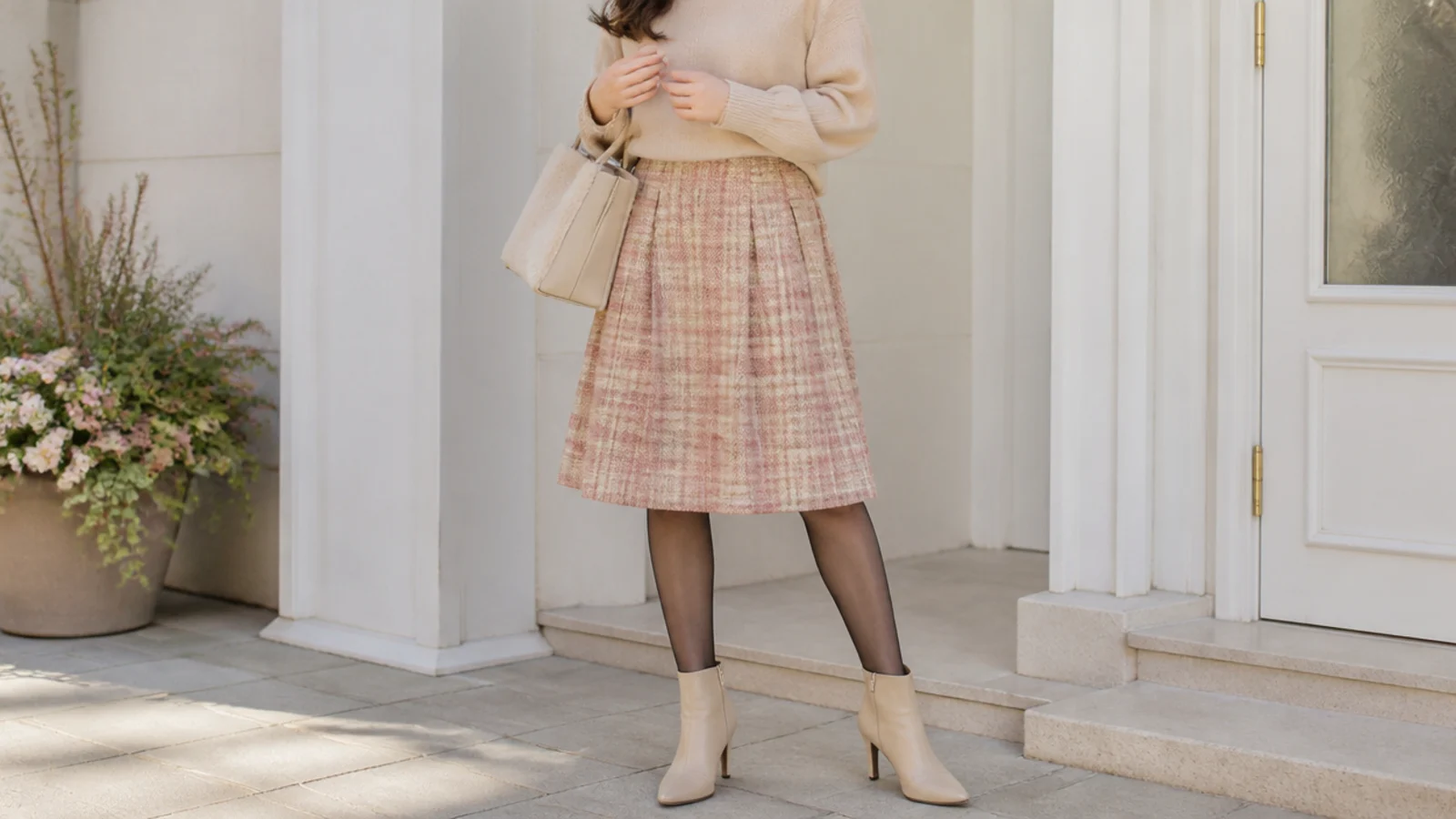 Faceless outfit with a knee-length A-line skirt, sheer tights and heeled almond-toe ankle boots