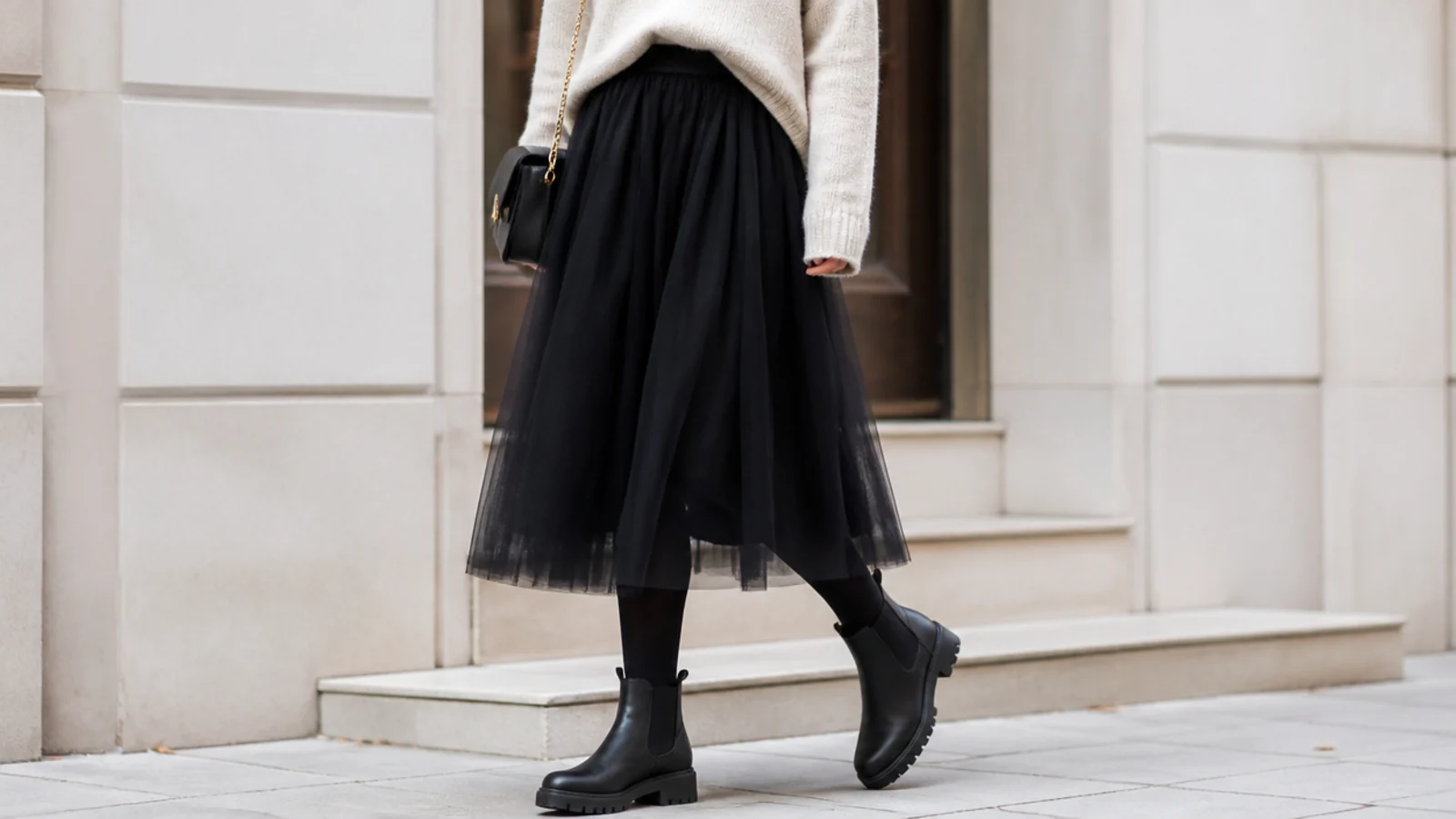 Faceless outfit with a black tulle midi skirt, opaque tights and chunky lug-sole ankle boots